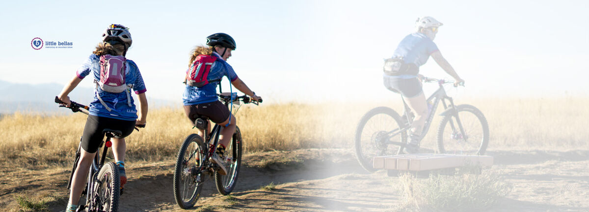 Two teenage girls riding bikes on a trail while wearing CamelBak Mini M.U.L.E.